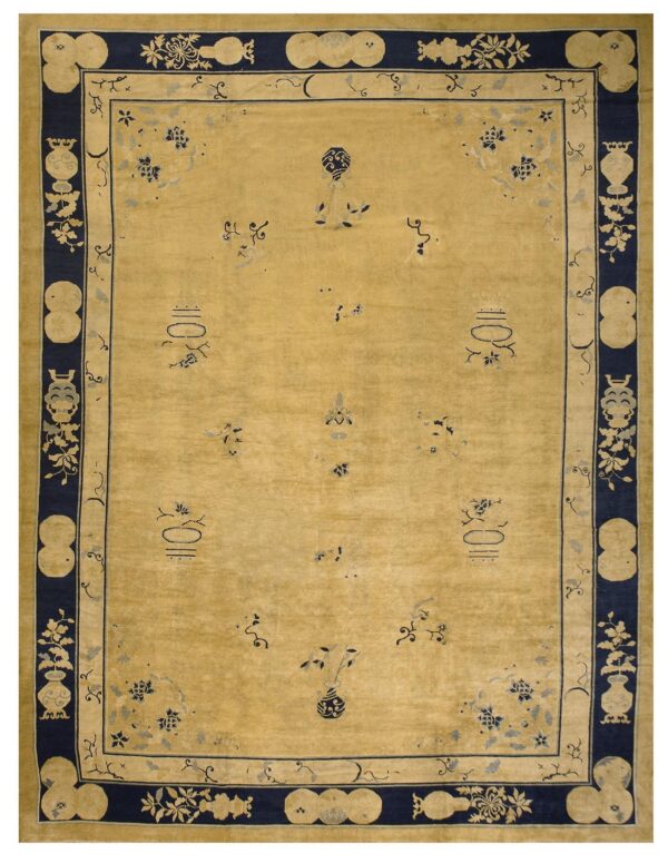 A golden yellow rug with scattered small navy patterns and an ornate dark blue border.