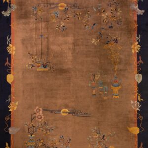 Brown rug with high sheen, dark blue border, and sparse, multi-colored floral and lantern motifs.