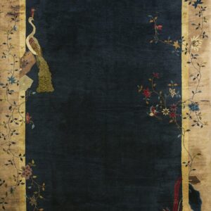 Navy blue rug with a tan border framed by climbing vines, colorful flowers, and corner bird designs.