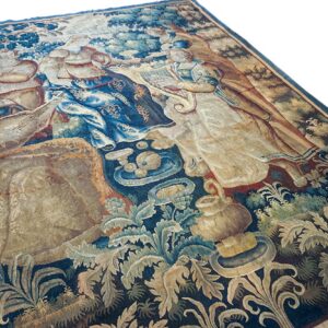 Flat rug featuring a detailed, classical scene of figures playing music amid blue and beige foliage.