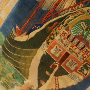 Medium pile rug featuring a stylized blue and red boat scene and colorful geometric accents on wood flooring.