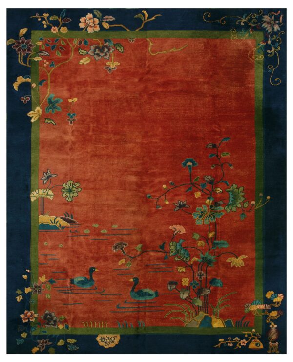 Rust red rug featuring two ducks swimming among floral vines within a dark blue and green border.