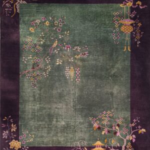 Deep moss green rug with a wide purple border and detailed floral Chinoiserie patterns.