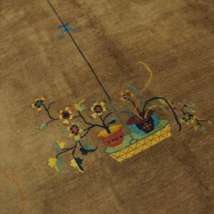 Brown pile rug with a stylized floral pattern featuring red, yellow, and blue pots and blooms.