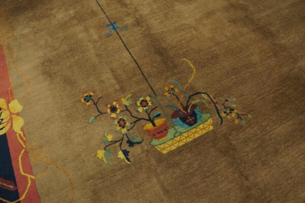 Brown pile rug with a stylized floral pattern featuring red, yellow, and blue pots and blooms.