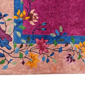 Plush rug corner featuring multicolored floral vines bordering a fuchsia center and blue stripe.