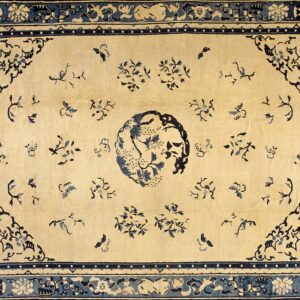 Oriental rug featuring a cream field with blue floral patterns, butterflies, and a detailed frame border.
