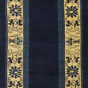 Dark blue runner rug with wide tan borders featuring stylized blue floral and scroll motifs.