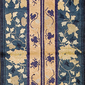Dark blue runner rug with intricate gold floral vines flanking a beige center stripe.