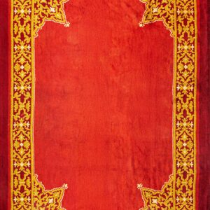 Ornate red and gold rug with a solid crimson field bordered by complex yellow scrollwork.