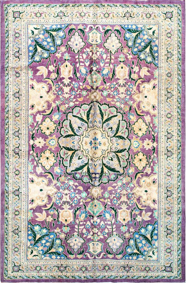 Traditional rug with dense floral motifs in cream, green, and blue on a bright purple field and layered border.