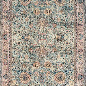 Long runner rug with a dense traditional floral pattern in muted turquoise, rose, and beige.