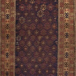 Dark blue rug with dense red geometric patterns and elaborate borders in tan and brown.