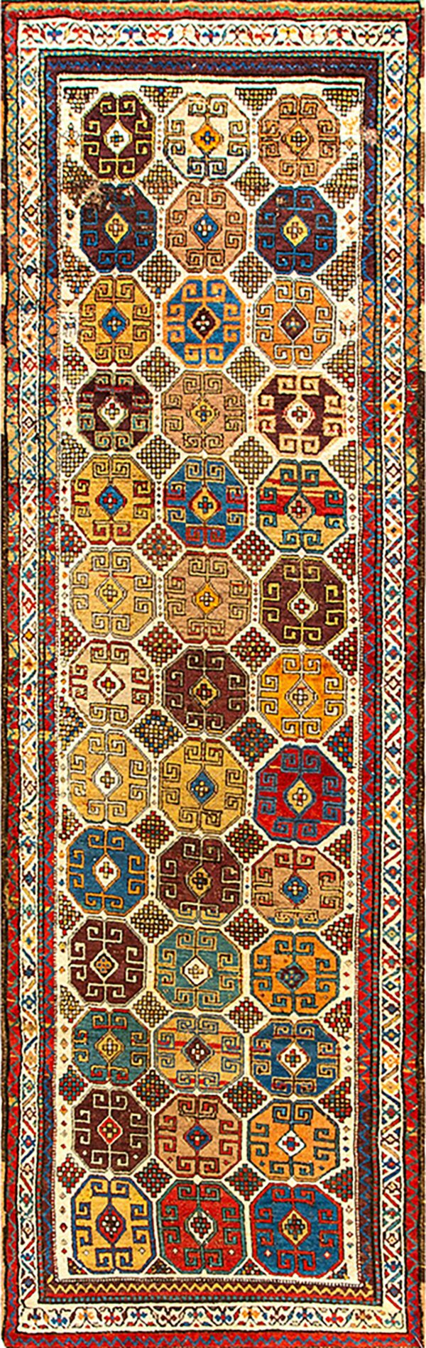Runner rug with repeating multicolored octagonal medallions in jewel tones of red, blue, gold, and brown.