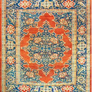 Blue and rust traditional rug with an elaborate central medallion and ornate floral borders.