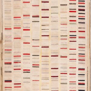 Textured cream rug displaying abstract colored bars, including red, maroon, black, and gray.