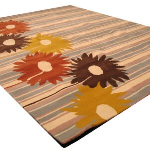 Modern rug with yellow, orange, and brown flowers layered on stripes of beige, dusty blue, and pink.