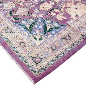 Traditional rug corner displaying faded floral patterns in mauve, cream, blue, and green against white.
