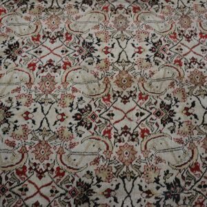Cream, red, and black traditional rug pattern with dense floral motifs and stylized paisley shapes.