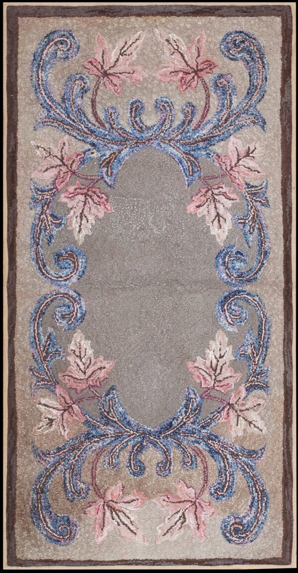 Ornate runner rug featuring a textured gray field, dark border, and blue and pink floral scrolls.