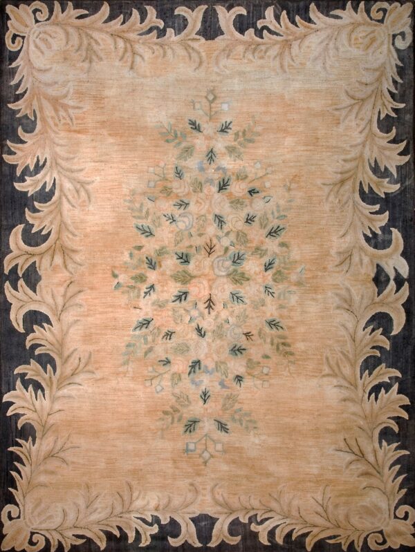 Peach field rug with dark borders and light scrolling botanical leaves surrounding a delicate floral cluster.
