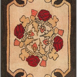 Beige panel rug framed by red maple leaves, featuring red roses and tan scrollwork on a dark field.