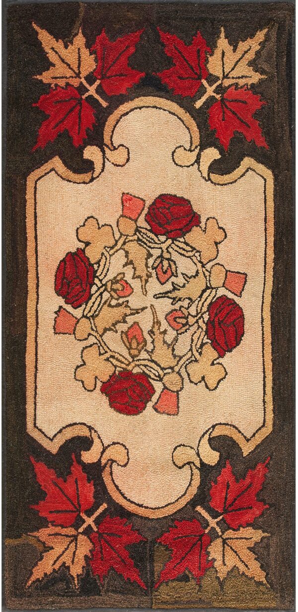 Beige panel rug framed by red maple leaves, featuring red roses and tan scrollwork on a dark field.