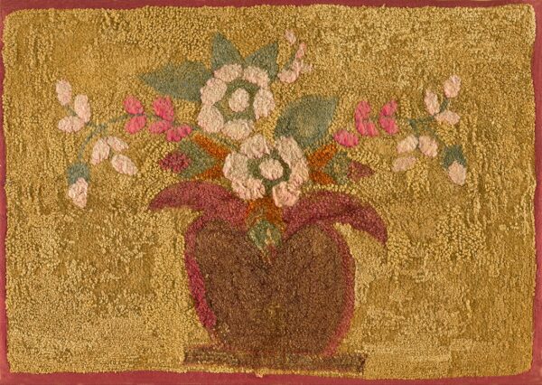 Textured gold rug featuring pink and cream flowers, green leaves, and a reddish-brown vase.