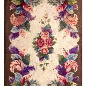 Ornate floral runner rug featuring a central pink rose bouquet framed by large colorful botanical scrolls on a brown ground.