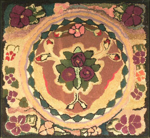Hooked square rug with a burgundy, green, and gold floral medallion centered on a multicolor, textured field.