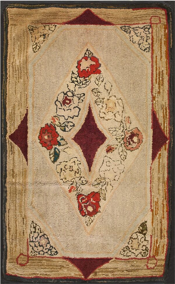 Highly textured rug featuring a central floral diamond on beige with burgundy corners and a tan border.