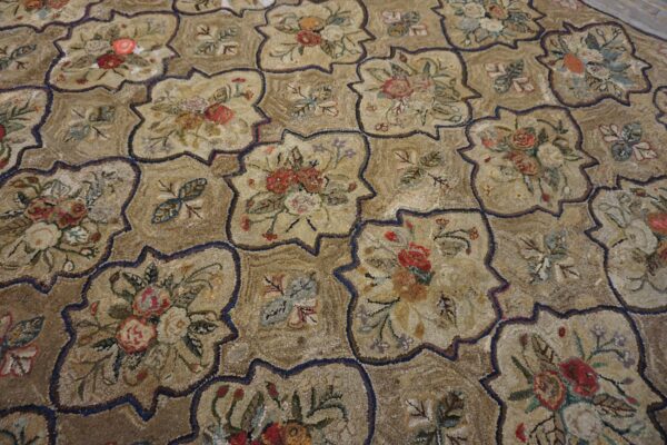 A textured, low-pile rug with beige quatrefoil medallions featuring multicolored floral bouquets.