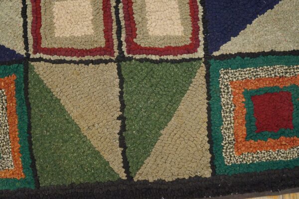 Concentric geometric pattern in a high, bumpy texture featuring beige, red, green, blue, and orange sections.