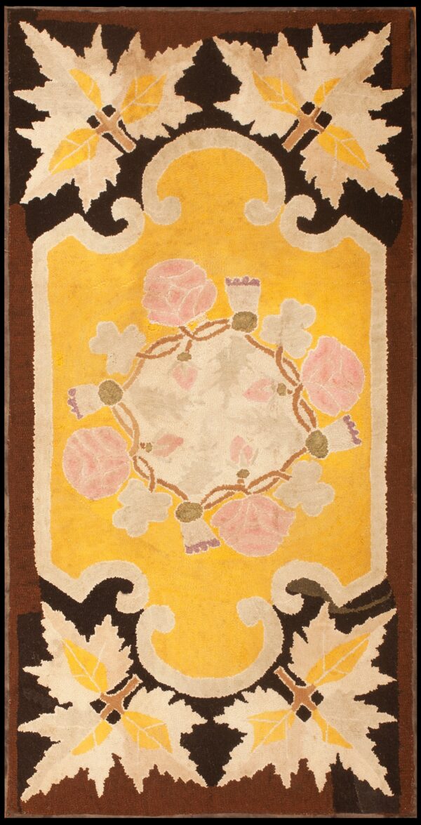 Stylized floral rug featuring a golden yellow field, pink roses, and dark brown foliate borders.