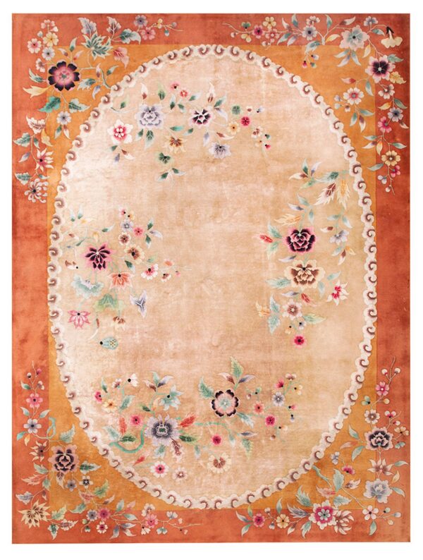 Rectangular rug featuring a soft tan oval field surrounded by rust-colored ornate floral borders.