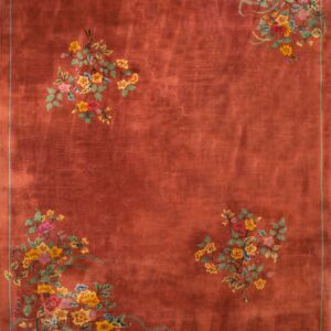 Rust-colored rug with high pile and multicolored floral clusters in the corners and upper field.