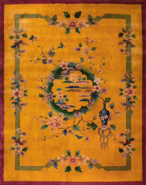 Golden yellow rug with a purple border, green geometric frame, and stylized floral and landscape motifs.