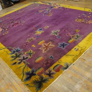 High-pile square rug featuring a deep purple field, multicolor floral pattern, and wide yellow border.