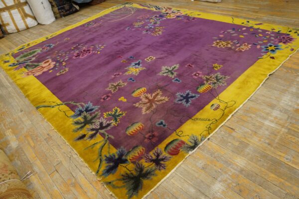 High-pile square rug featuring a deep purple field, multicolor floral pattern, and wide yellow border.
