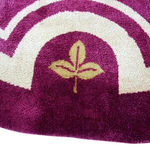 Deep purple, cream, and gold high-pile rug featuring curved geometric bands and a central leaf design.