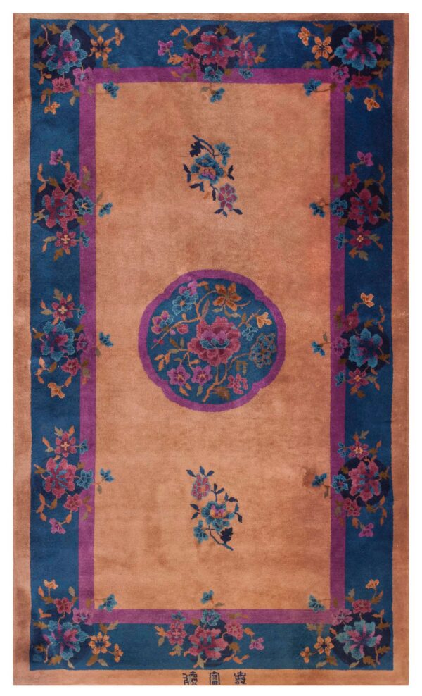 Sienna field rug featuring a bold blue and magenta floral medallion and wide botanical borders.