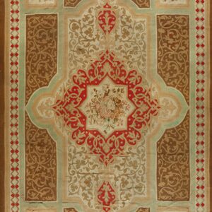 Low-pile rug with red, tan, and brown ornate patterns, featuring a central medallion and floral corner squares.