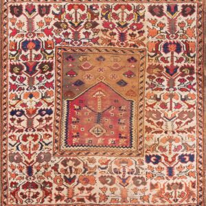 Low-pile rug displaying intricate geometric and floral patterns in red, cream, blue, and earthy browns.