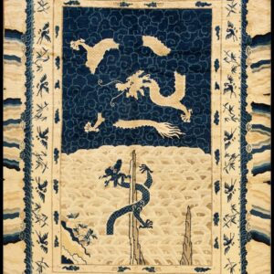 Pictorial rug in cream and navy blue showing dragons, cloud motifs, and a border with birds and bamboo.