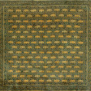 Distressed square rug in gold and dark teal, featuring a dense interlocking geometric fret pattern with borders.