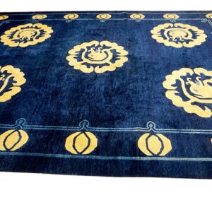 Navy blue rug with vibrant yellow floral motifs and a patterned light blue border detail.