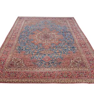 Large rectangular rug featuring a detailed traditional floral medallion pattern in red and blue.