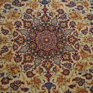 Low-pile rug with a cream field and dense navy, red, light blue, and orange traditional floral designs.