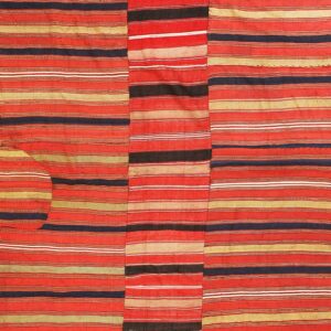 Three vertical panels form a flatweave rug patterned with dense horizontal stripes in red, tan, and black.