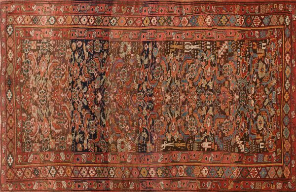 Traditional rectangular rug featuring detailed floral and geometric motifs in faded rust, brown, and dark blue tones.